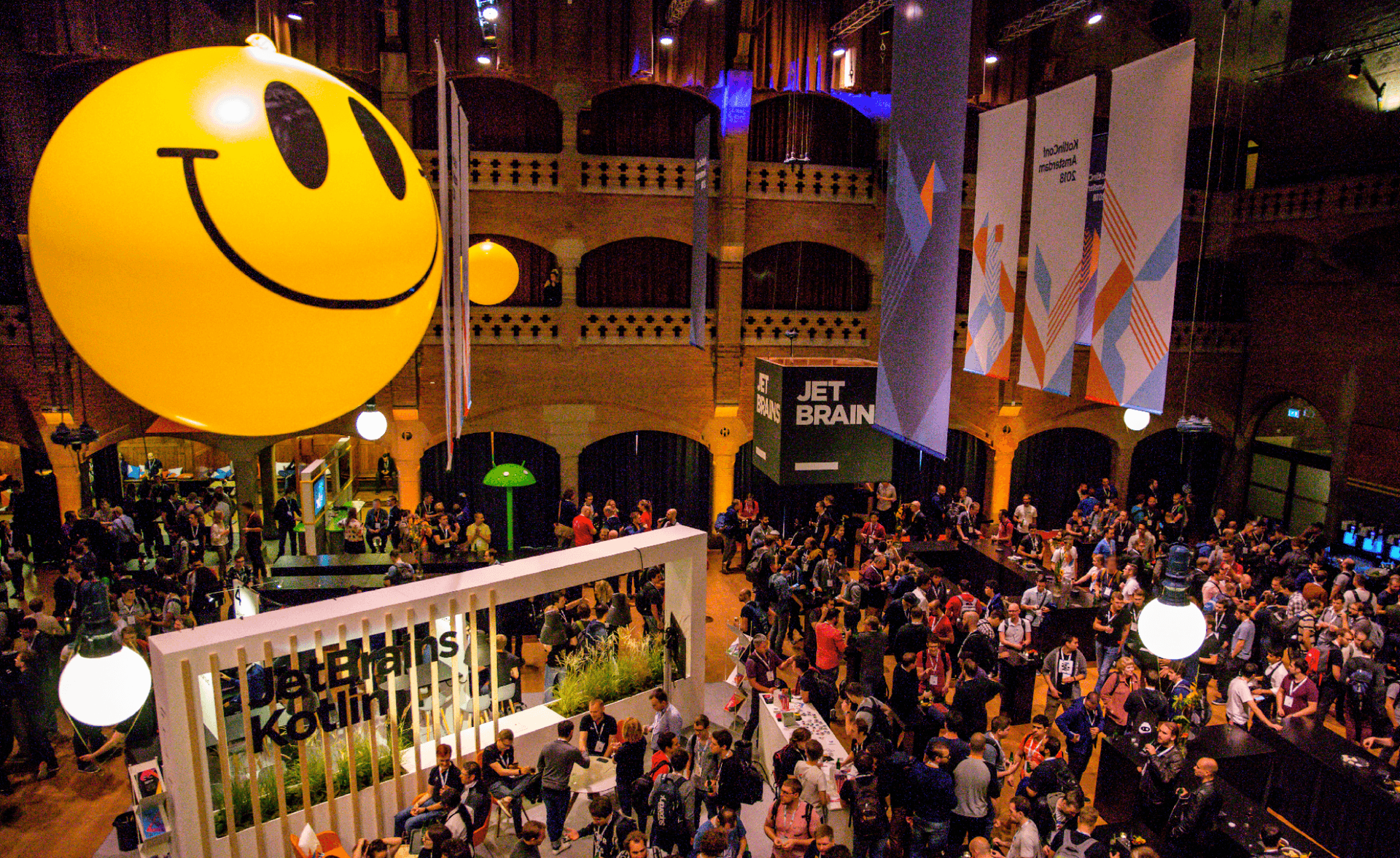 Building with 'Beurs van Berlage' sign and text: 'Conference Venue: Beurs van Berlage, Amsterdam, The Netherlands'